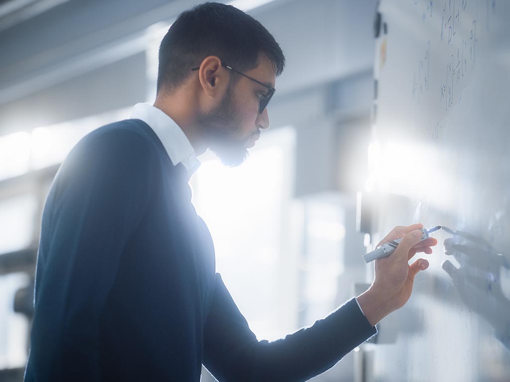 University student working on math equation