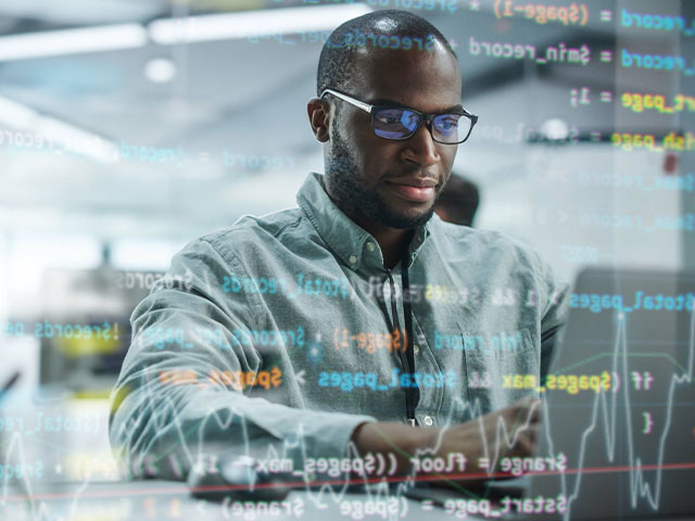 Graduate student working on computer coding